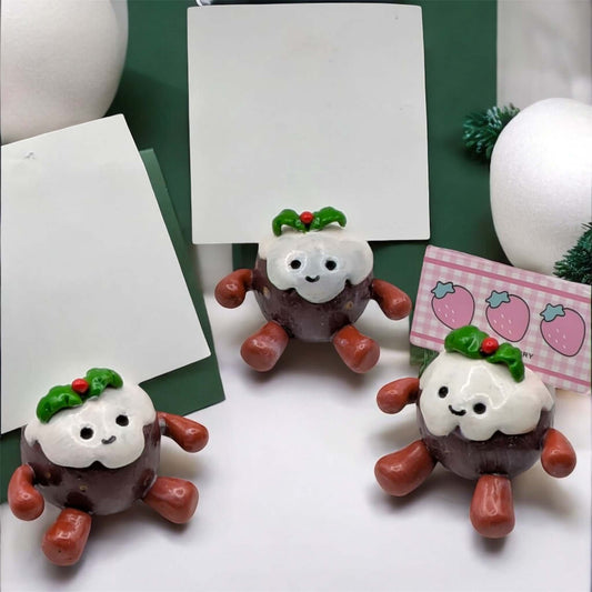 Christmas pudding photo holders shown on a white background
