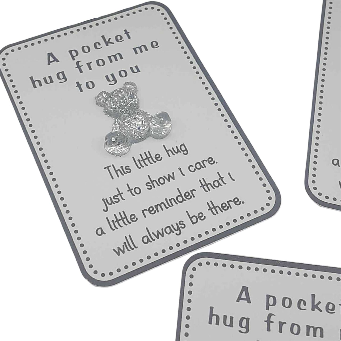 White card with teddy bear and text 'A pocket hug from me to you' on a white background