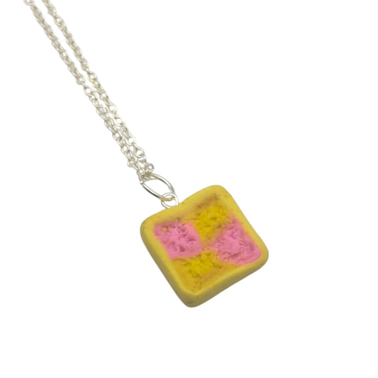 Necklace with a square pendant featuring pink and yellow squares on a white background