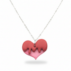 Red and pink heart-shaped dripped pendant on a silver chain against a white background