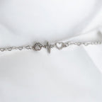 Paw bracelet featuring a silver paw print, heart charm, and heartbeat design, symbolizing pet love and companionship.
