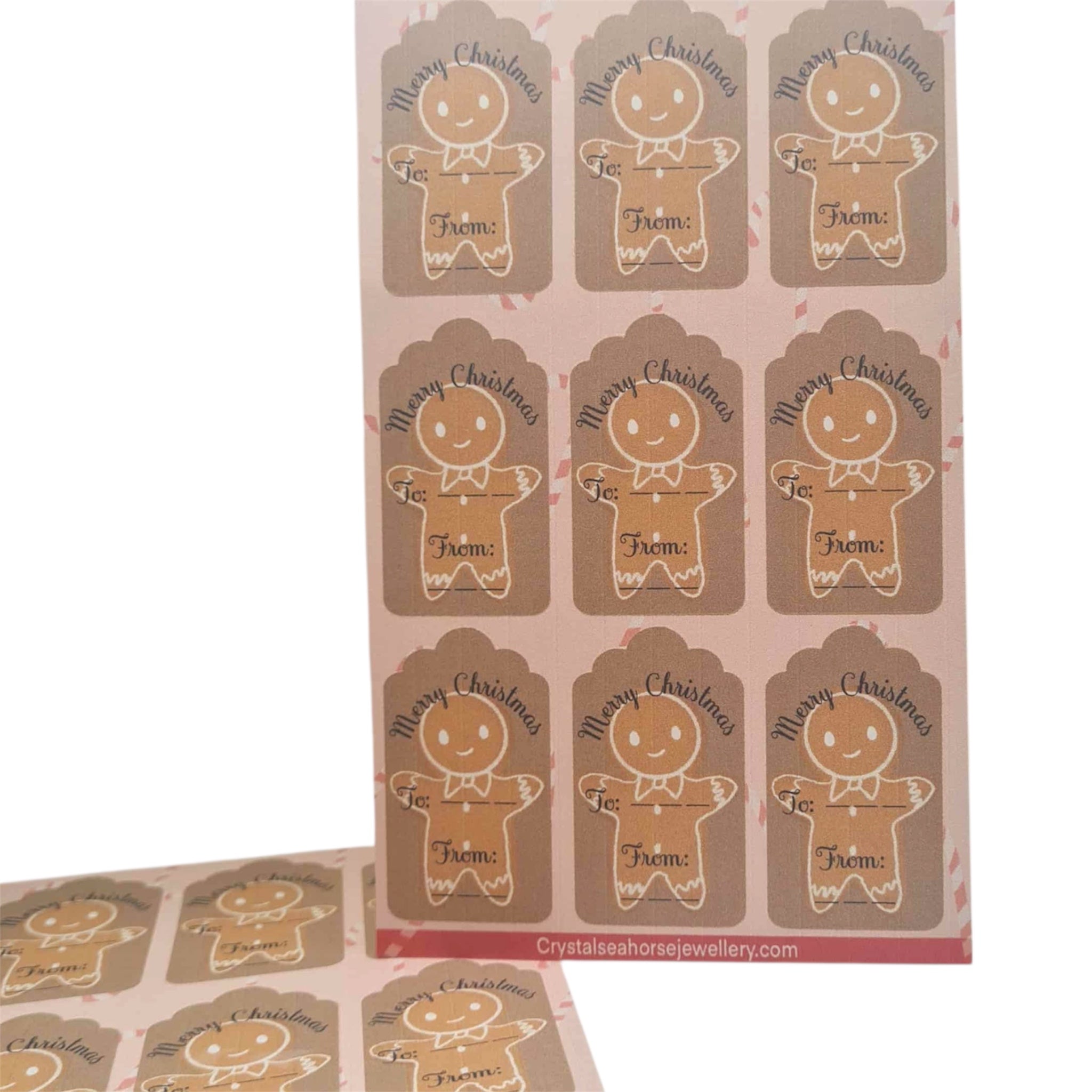 Sheet of gingerbread man Christmas gift tags with 'Merry Christmas' text.