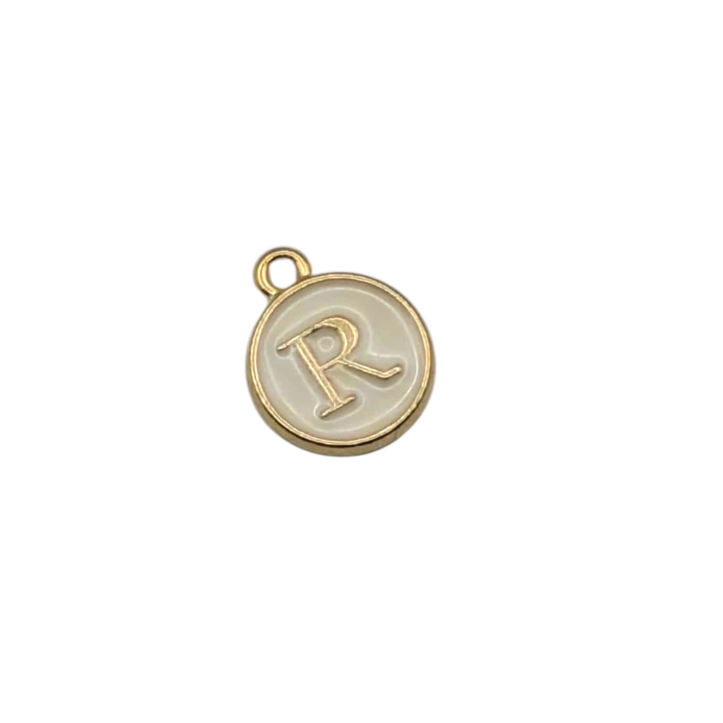 Gold pendant letter “ R “ on white background 