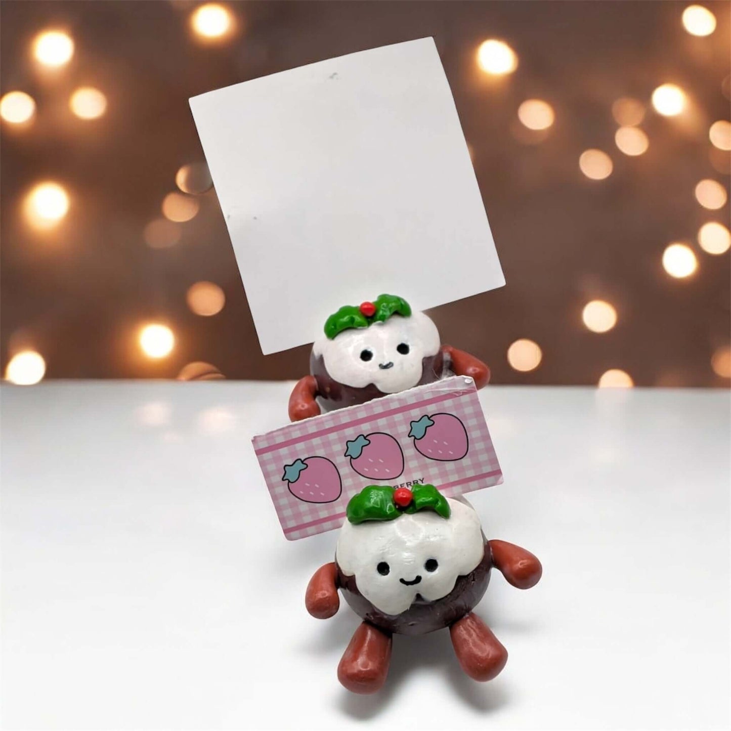 Cute decoration for Christmas on festive lit surface 