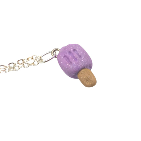 Necklace with a purple glittery ice pop pendant on a white background handmade UK