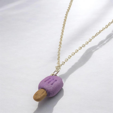 Close up of purple ice lolly made with polymer clay on a silver plated 18” chain 