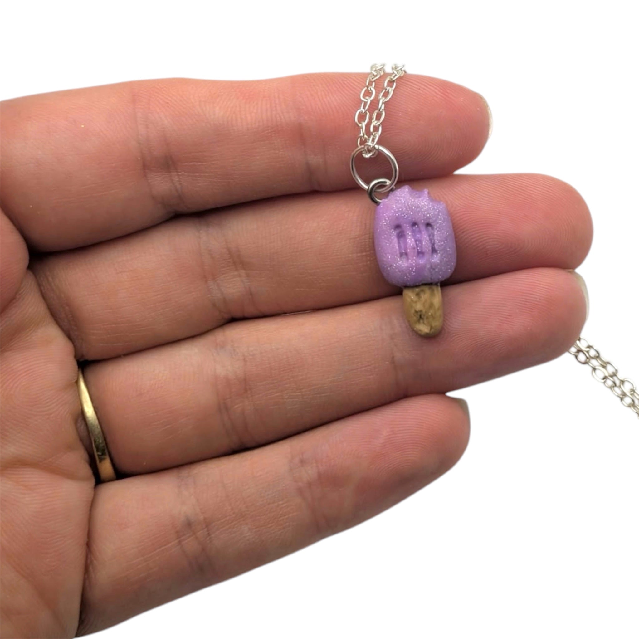 Glitter ice lolly necklace held in hand, handmade polymer clay charm UK