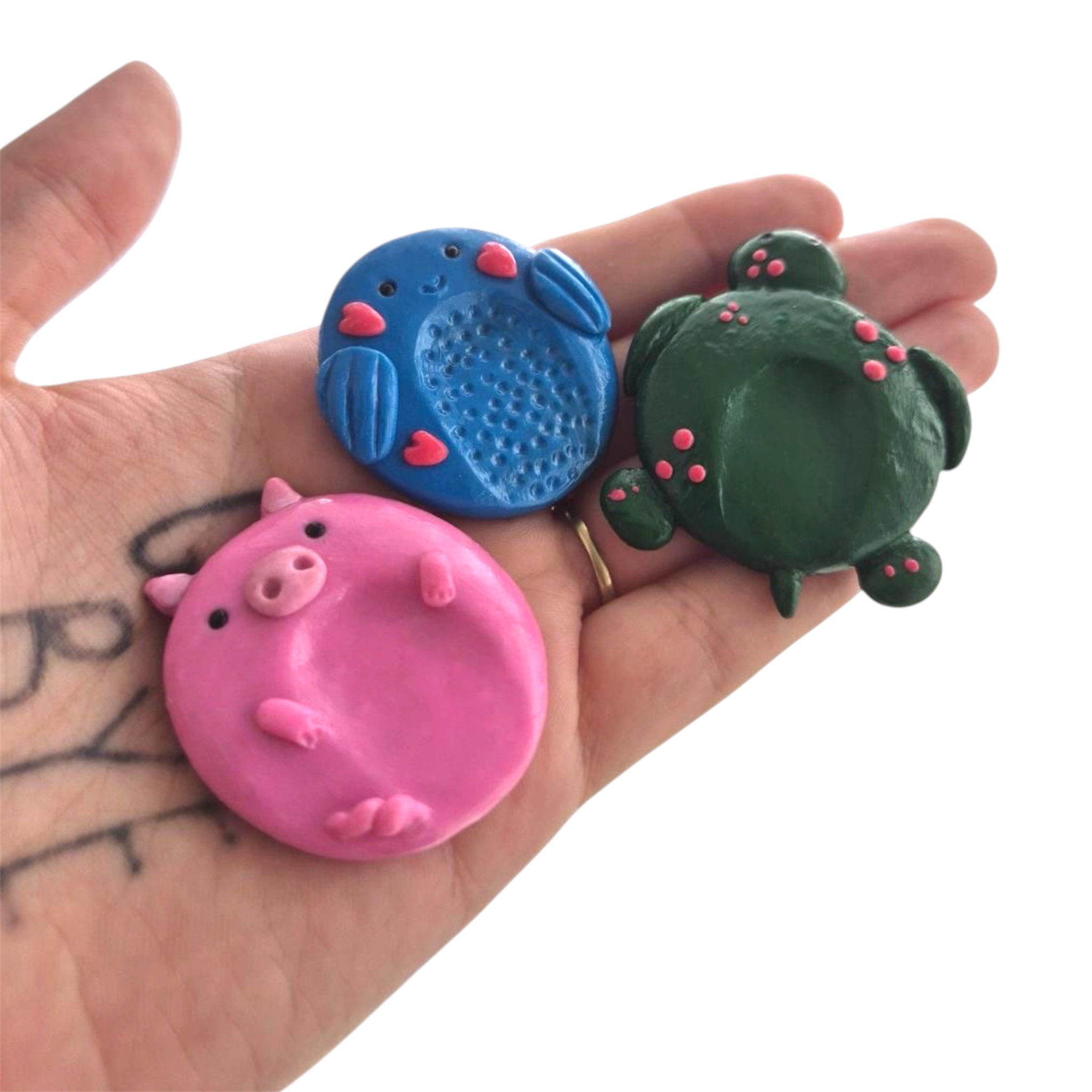 Blue whale polymer clay worry stone held in hand