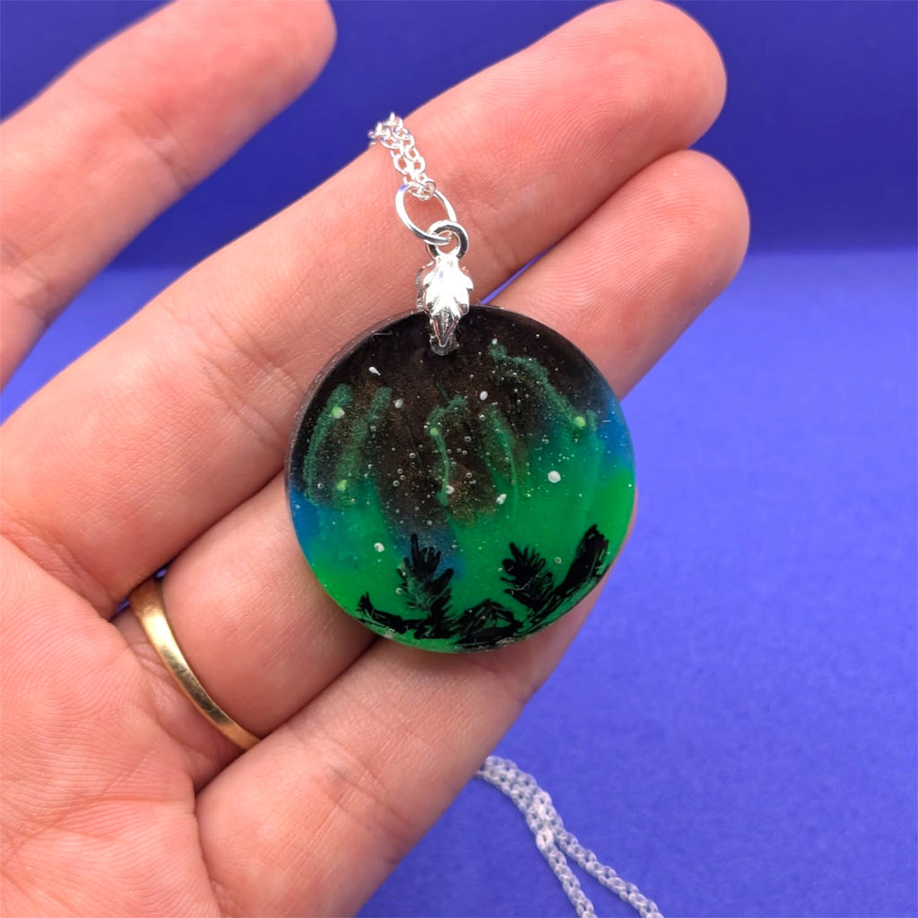 Aurora Borealis Necklace held in hand to show size