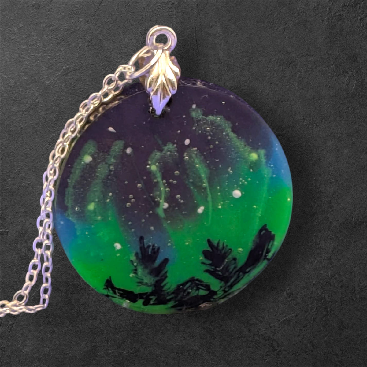 Aurora Borealis Necklace round pendant showing green and blue resin design