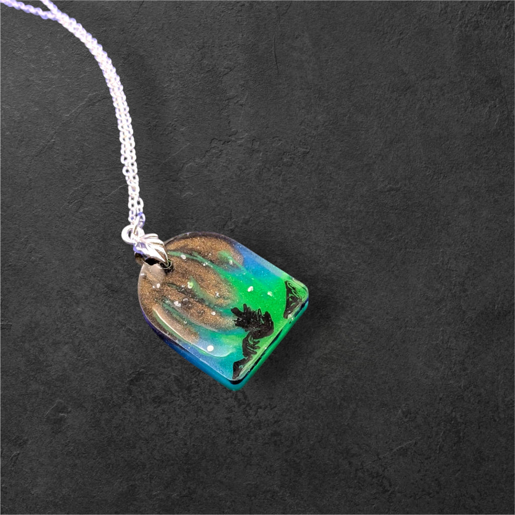 Aurora Borealis Necklace glowing green in the dark