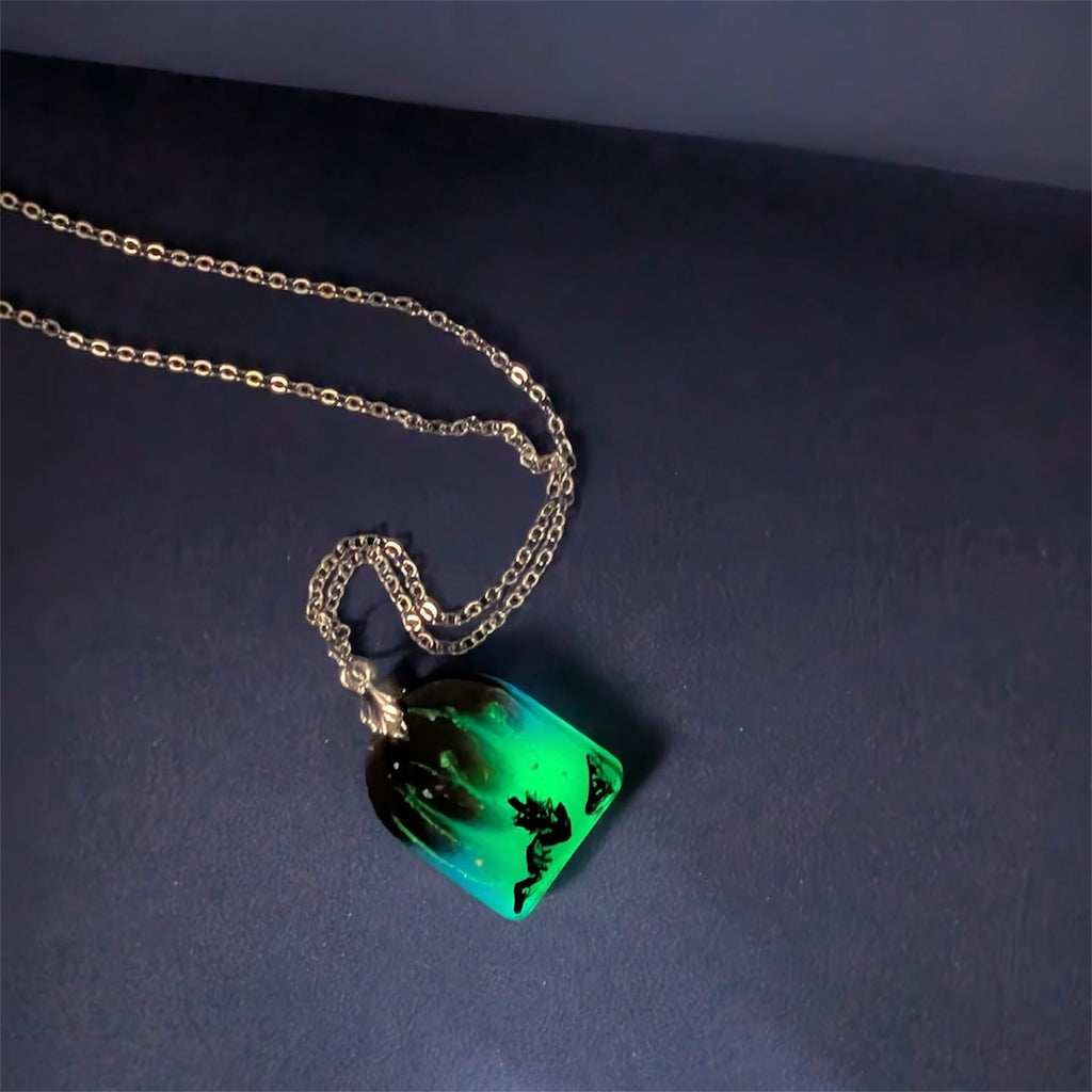 Aurora Borealis Necklace pendant showing green and blue resin design