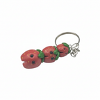 Strawberry-shaped keychain on a white background