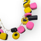 Bracelet with colourful beads on a white background