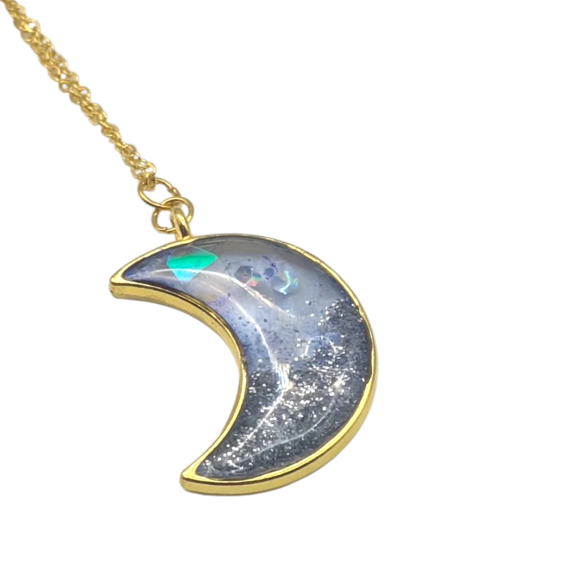 Crescent moon-shaped pendant with gold outline on a white background