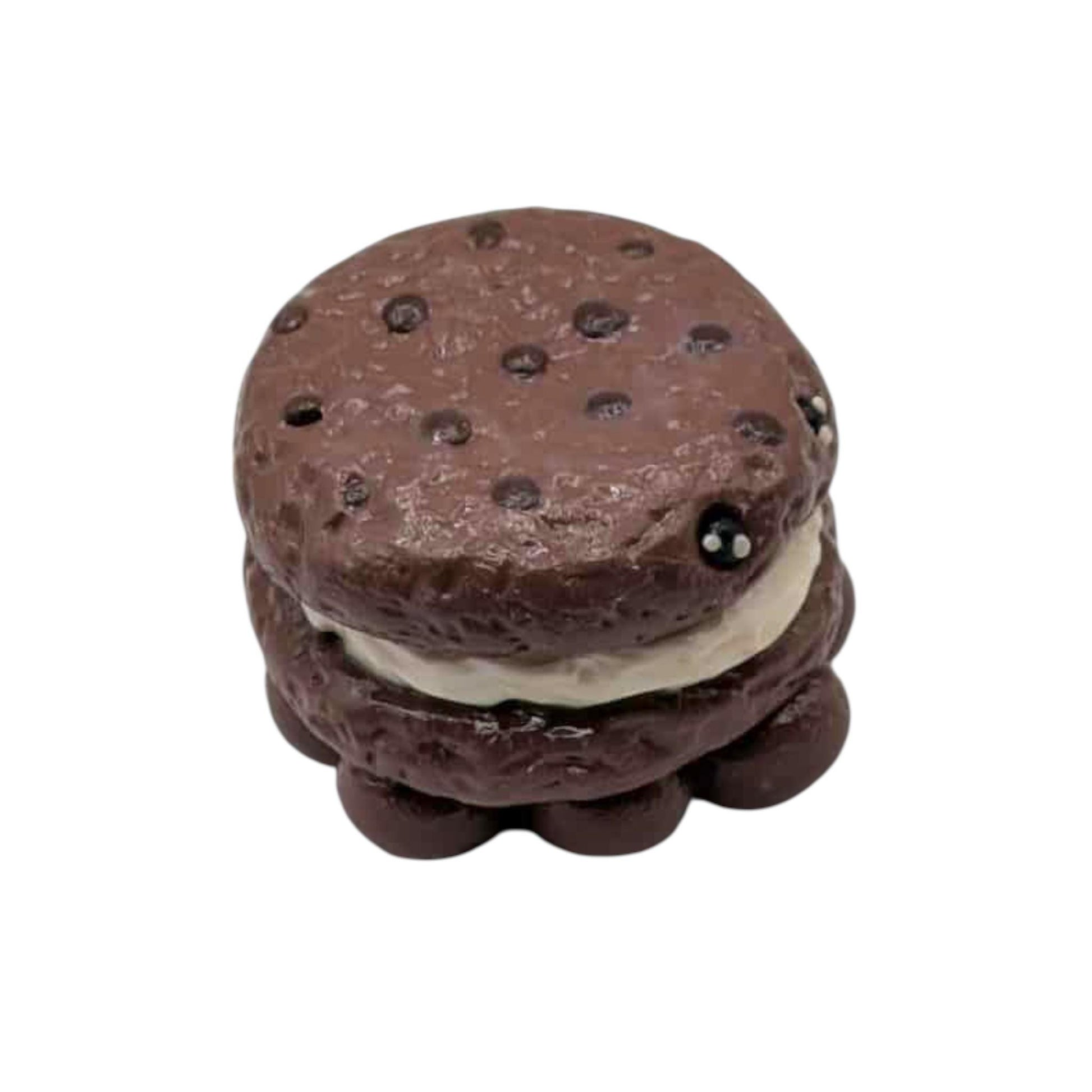 Chocolate cookie sandwich with cream filling on a white background