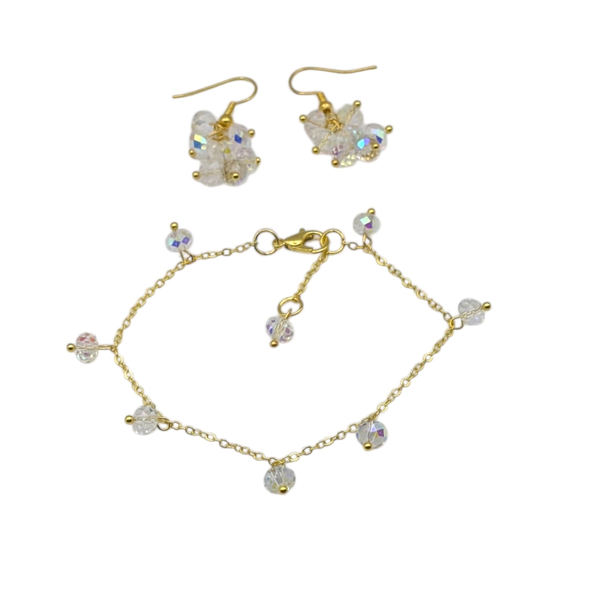 Cluster earrings and simple gold bracket on white background 