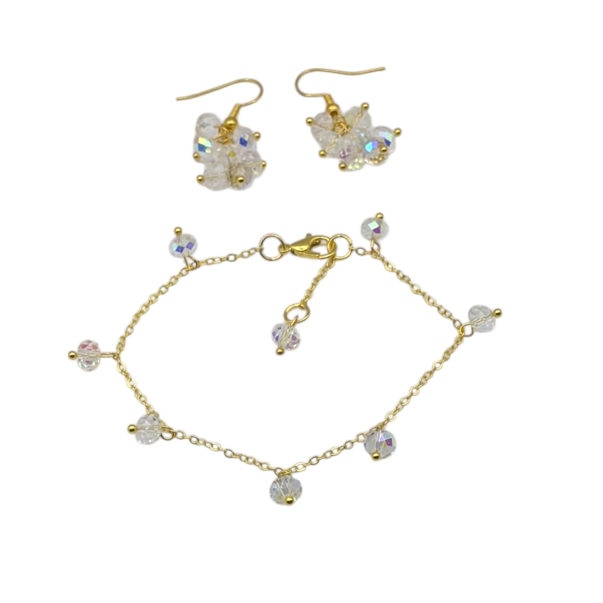 Cluster earrings and simple gold bracket on white background 