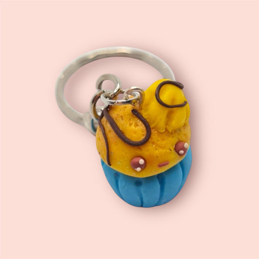 Keychain with a yellow character on a pink background