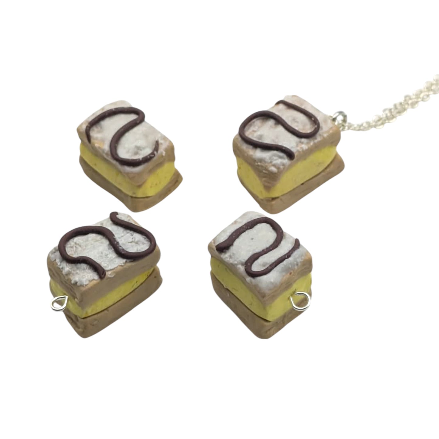 Four square pastries with a chain on a white background