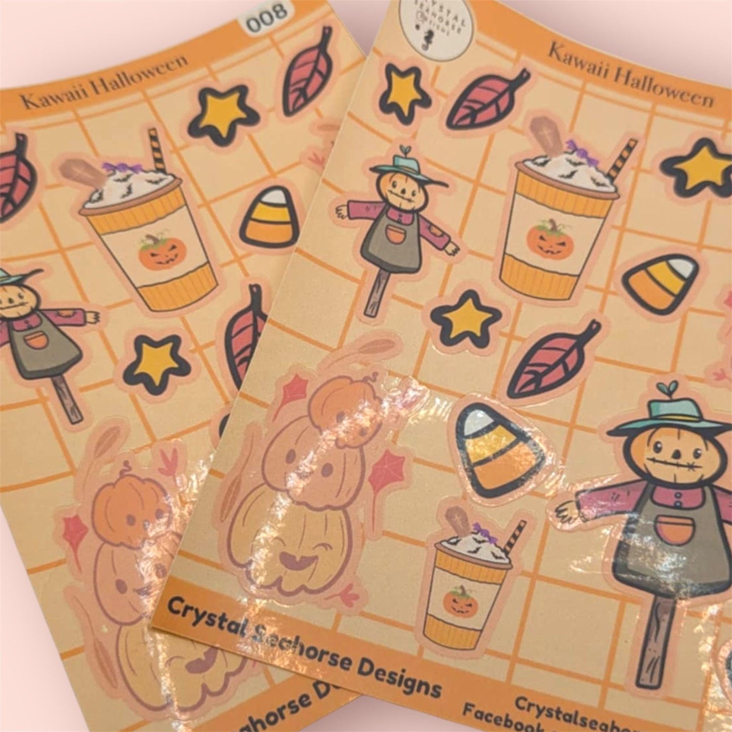 Kawaii Halloween-themed sticker sheets with pumpkins, candy corn, and stars on a grid background.
