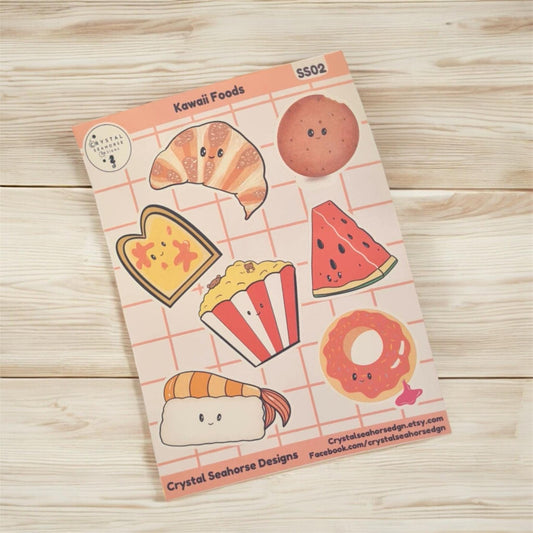 Sheet of kawaii food-themed stickers on a wooden surface
