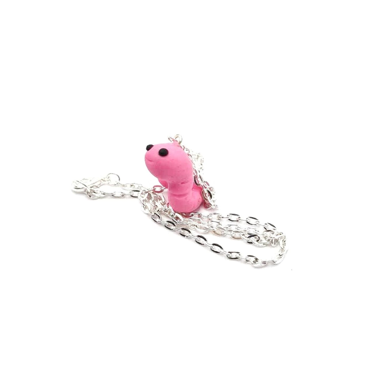 Pink worm-shaped charm on a silver chain against a white background