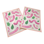 Two sheets of pink worm stickers with green leaves and flowers on a white background
