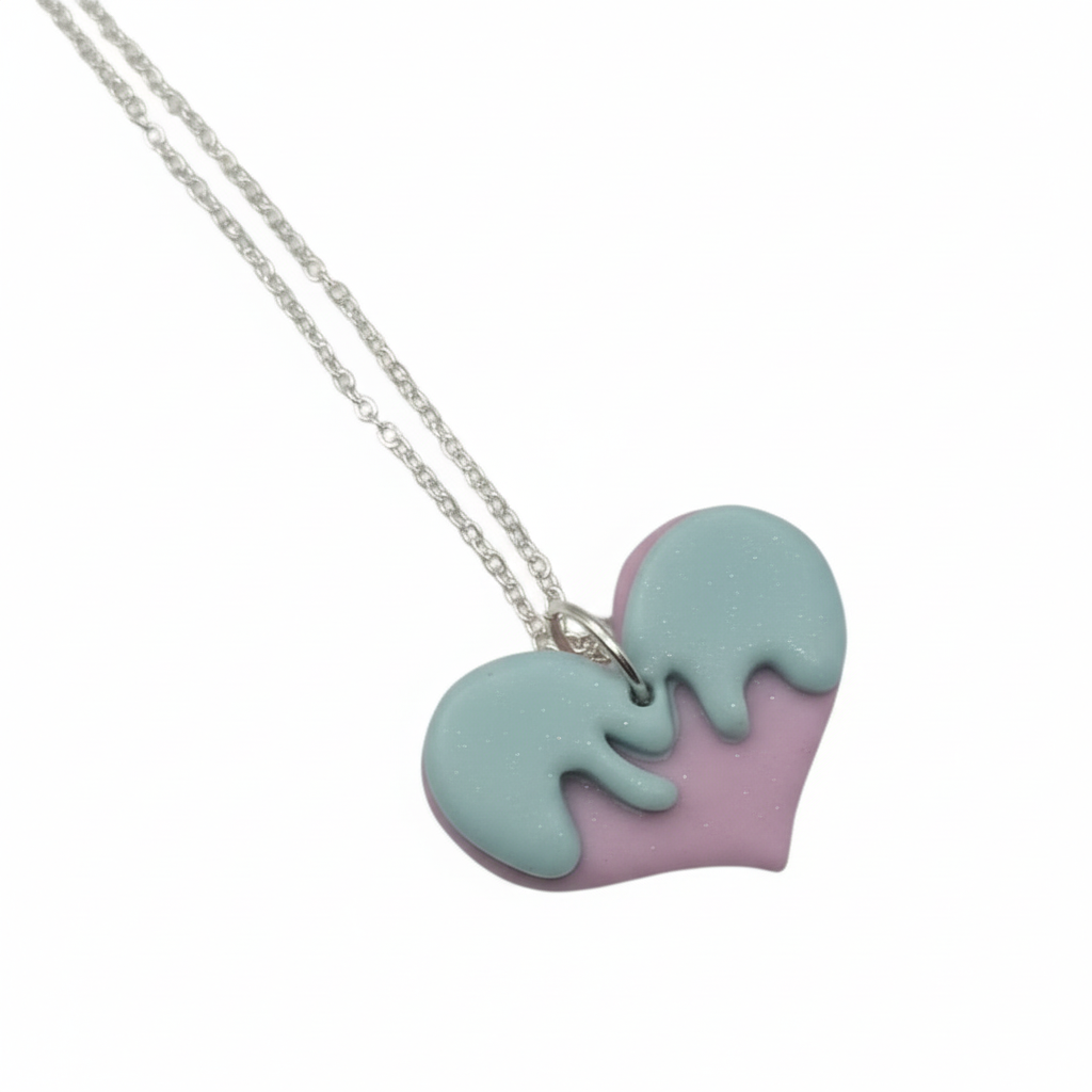 Necklace with a heart-shaped pendant in purple and light blue on a white background