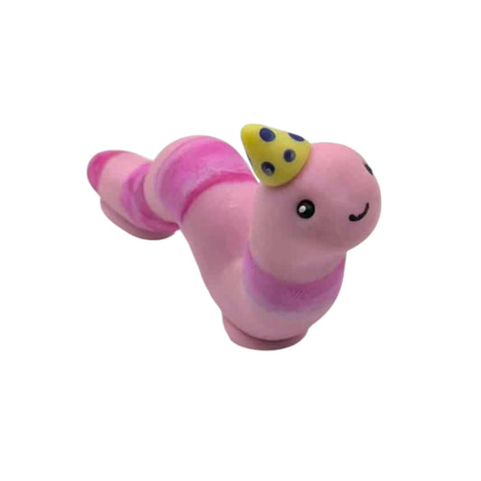 Pink worm figurine with a yellow hat on a white background