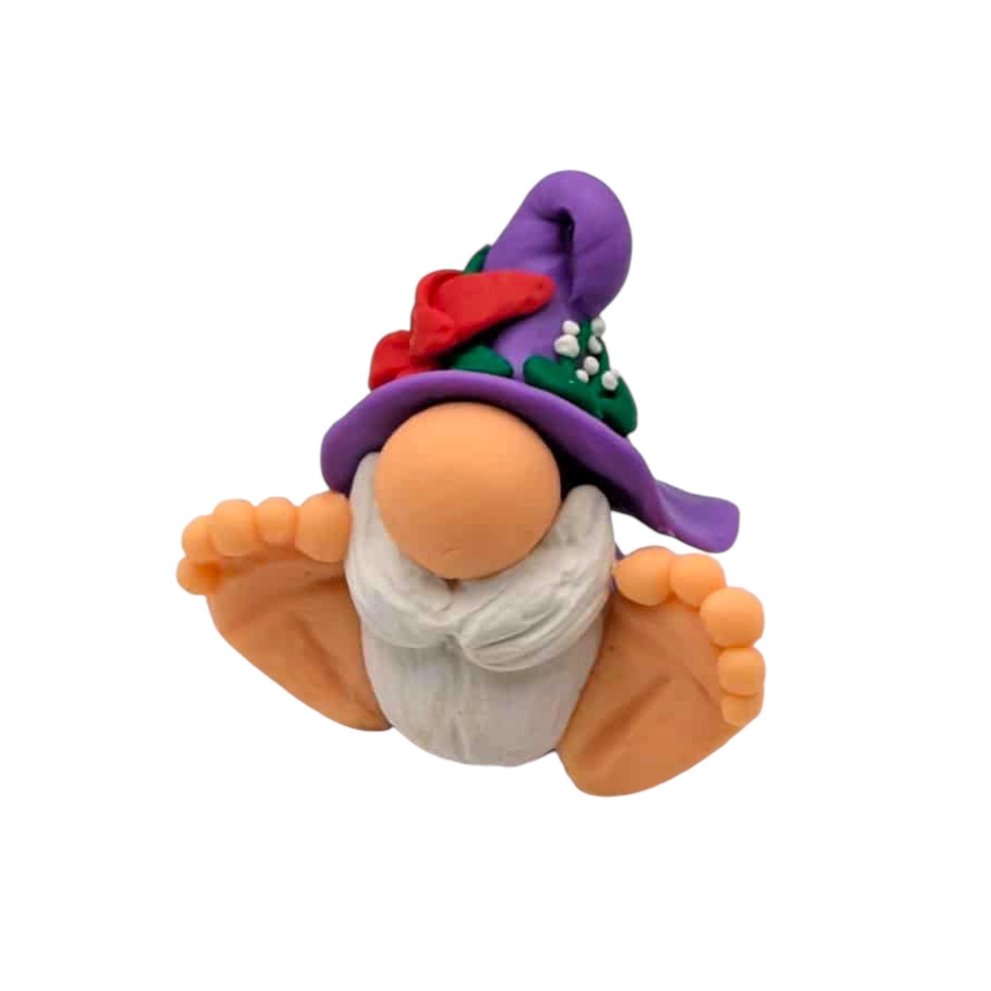Gnome figurine with a purple hat on a white background