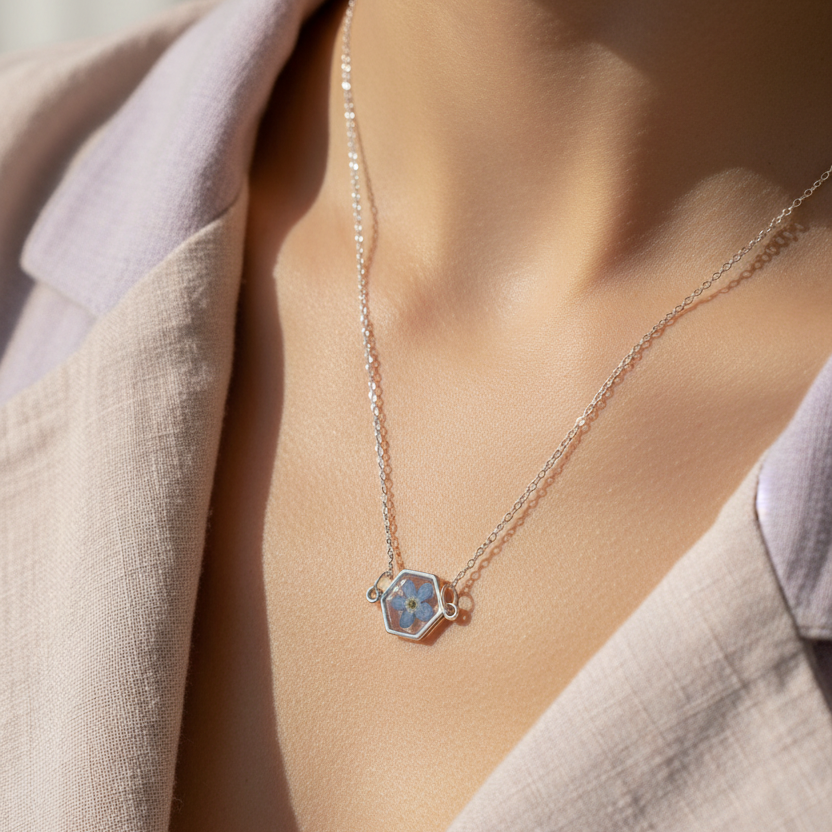 Blue flower pressed forget me not necklace with hexagonal resin filled pendant silver plated chain 