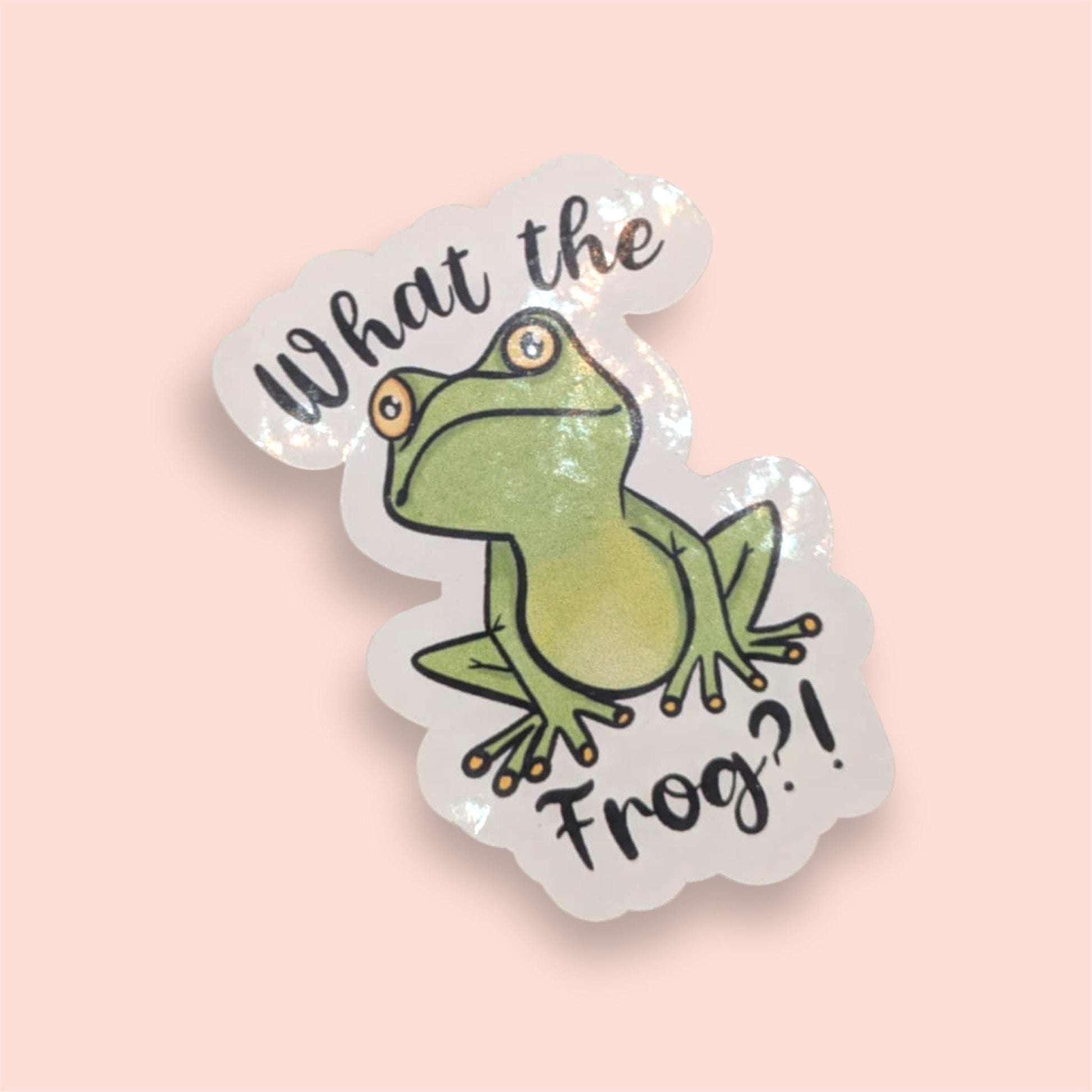 Sticker with a frog illustration and text 'What the Frog?' on a pink background