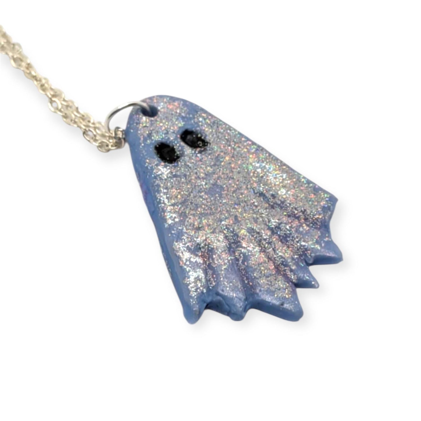 Blue glittery ghost-shaped pendant on a chain against a white background