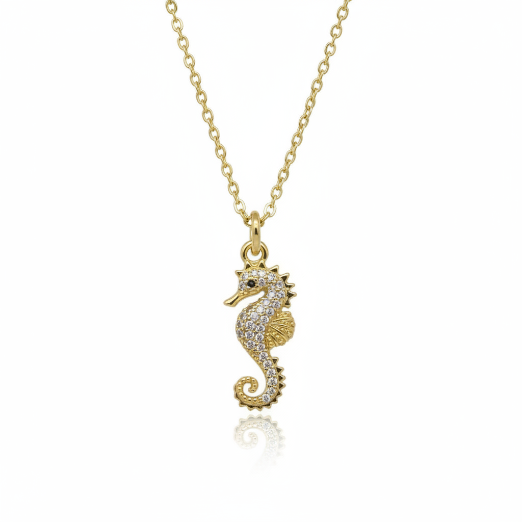 Textured gold seahorse charm necklace showing intricate 22mm pendant detail and chain links