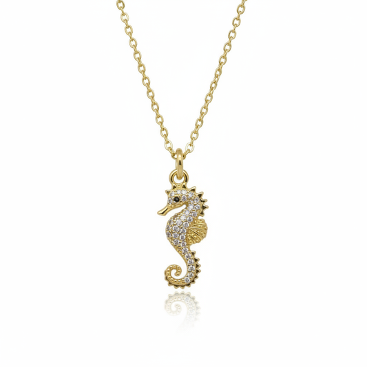 Textured gold seahorse charm necklace showing intricate 22mm pendant detail and chain links