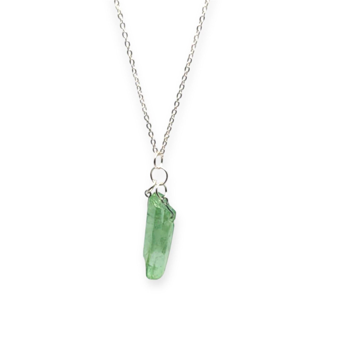 Necklace with a green crystal pendant on a white background