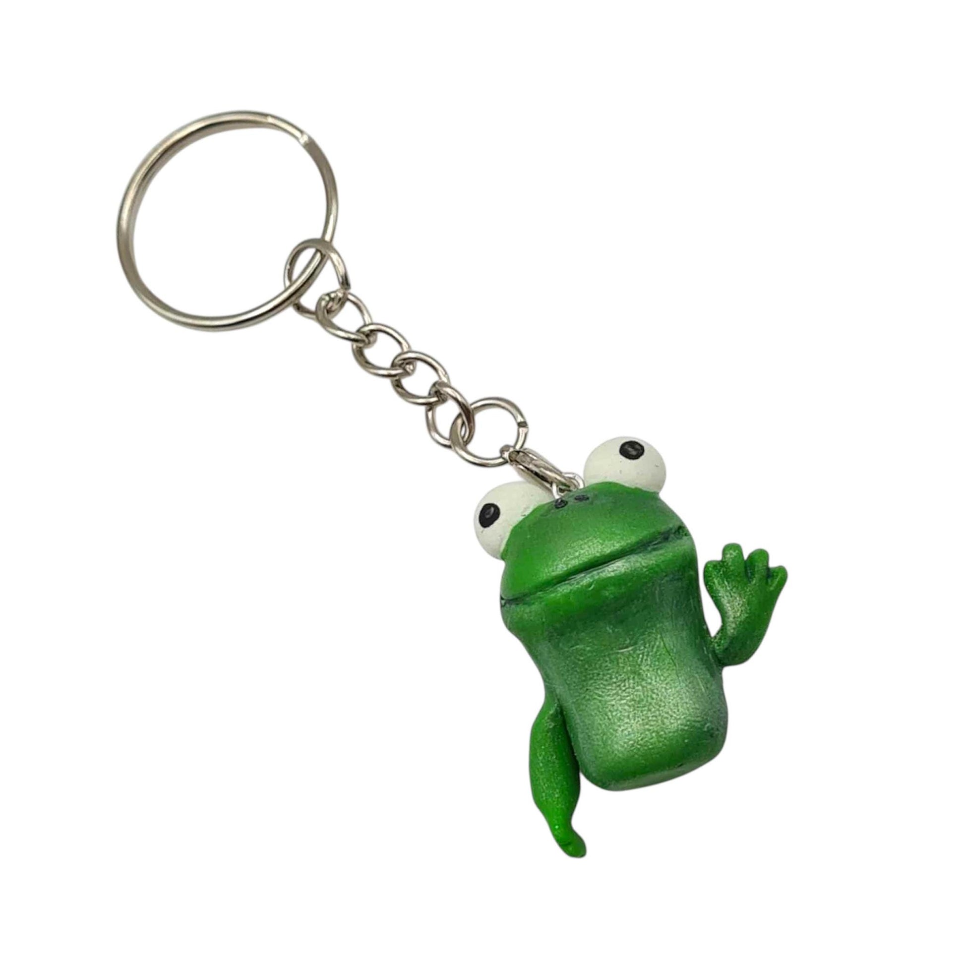 Green frog-shaped keychain on a white background