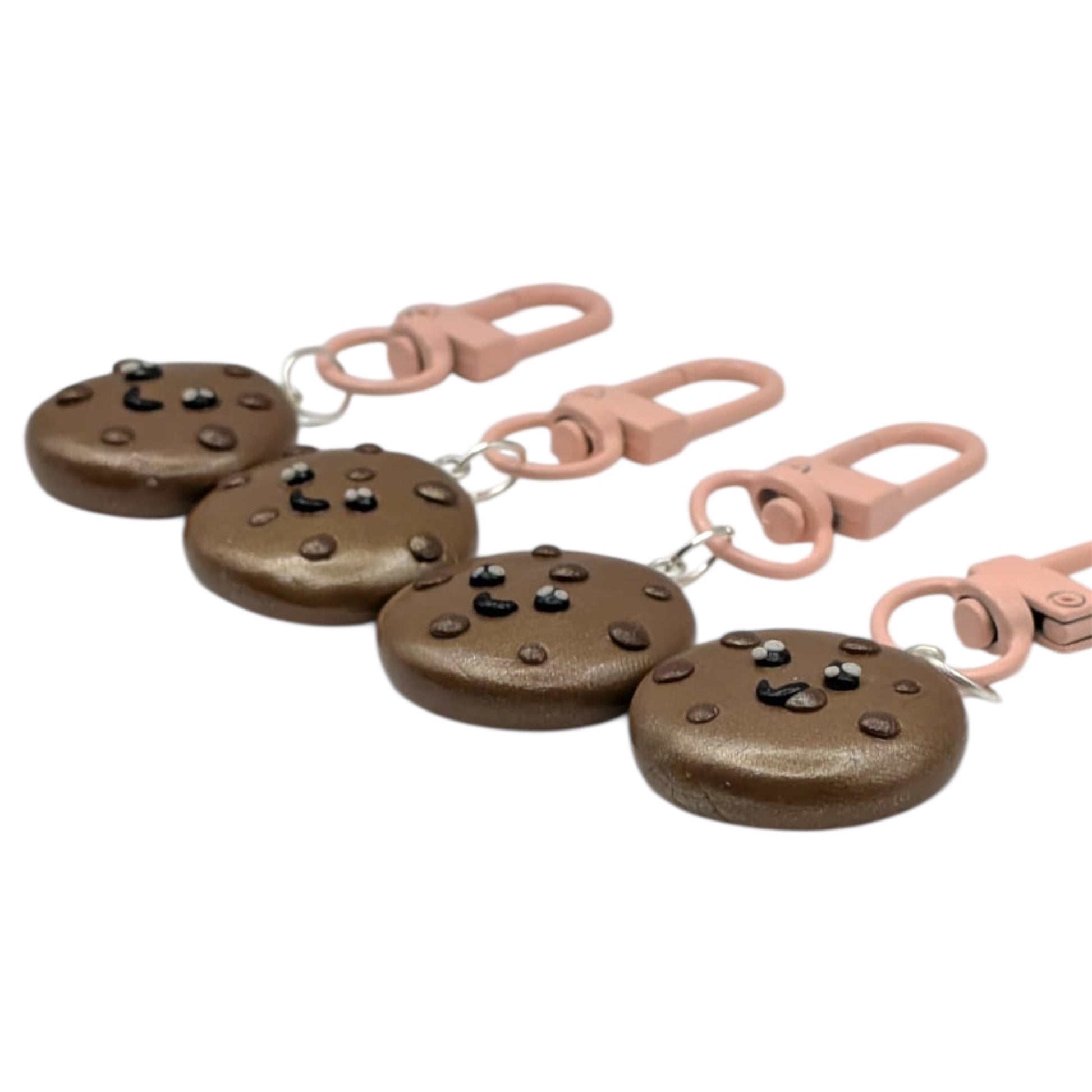 Set of brown cookies with pink clip on a white background
