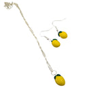 Lemon necklace and earrings, silver plated yellow summer jewellery gift set on white background  