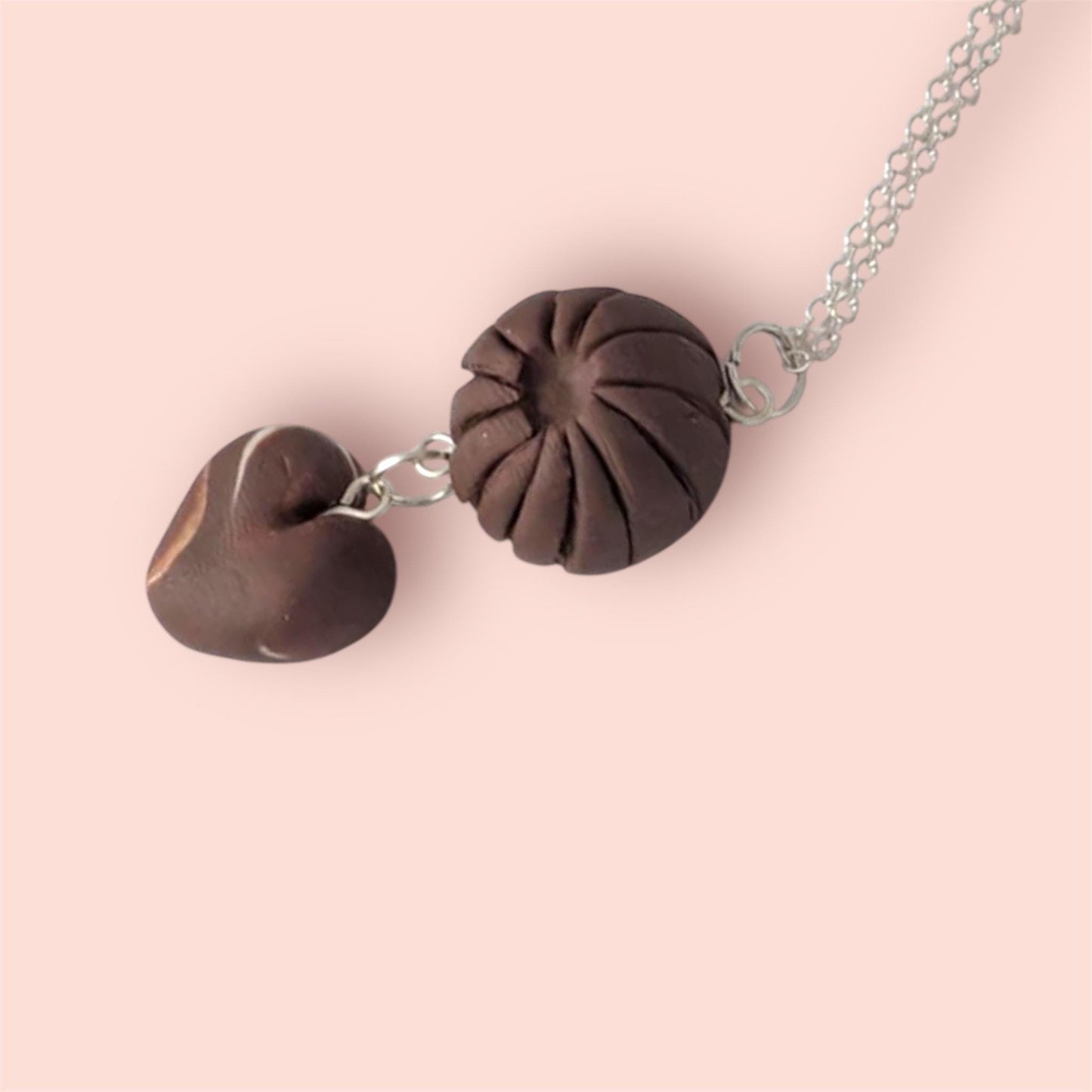 Necklace with brown chocolate pendants on a silver chain 