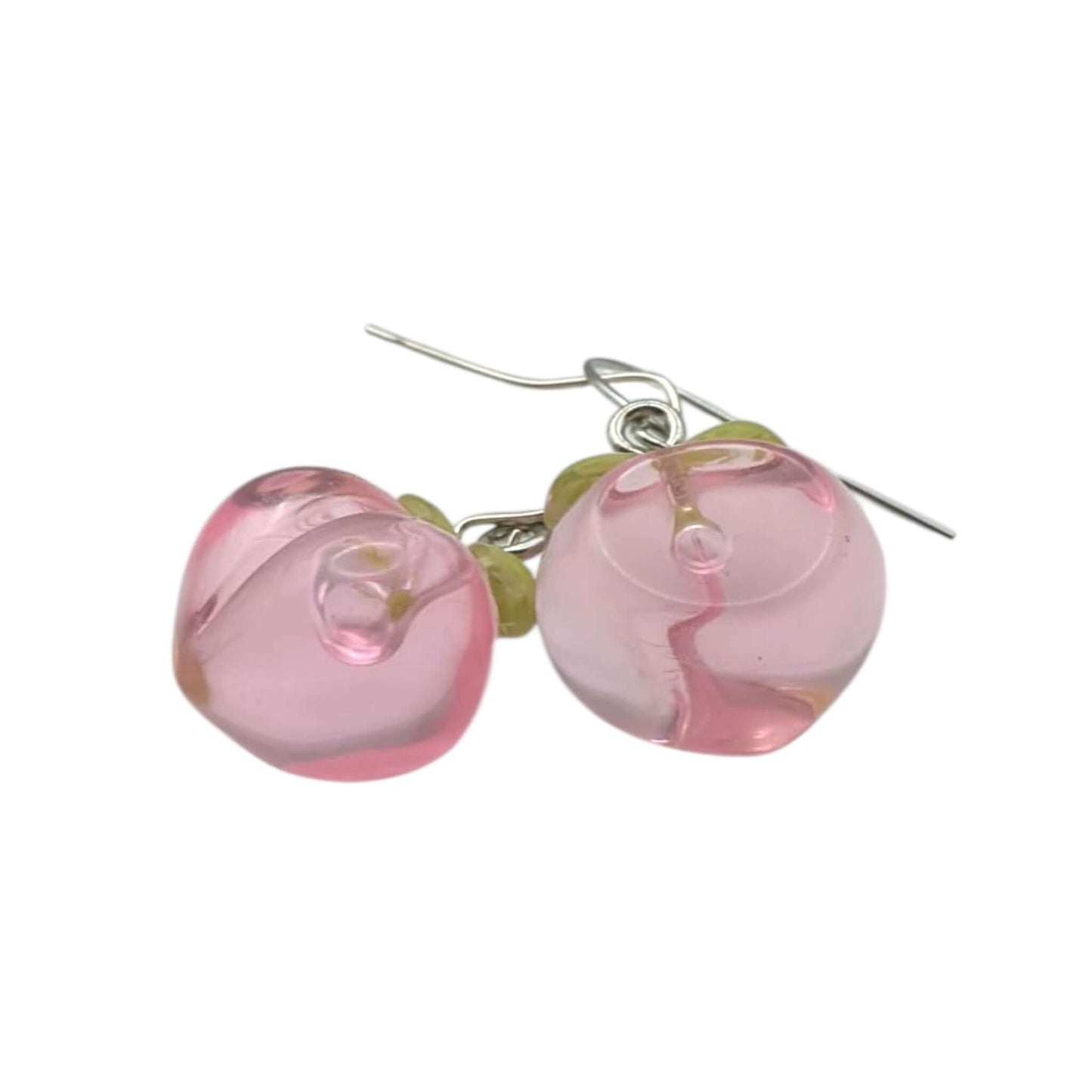 Cute peach dangle earrings on a white background 