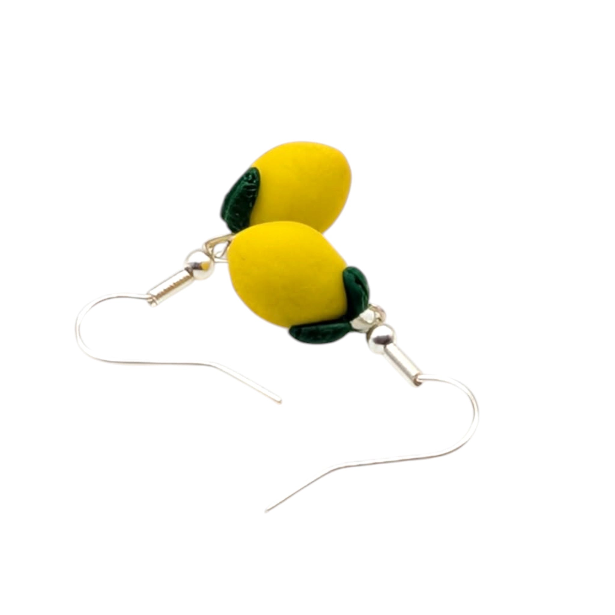 Close up of yellow lemon earrings, handmade polymer clay fruit jewellery.
