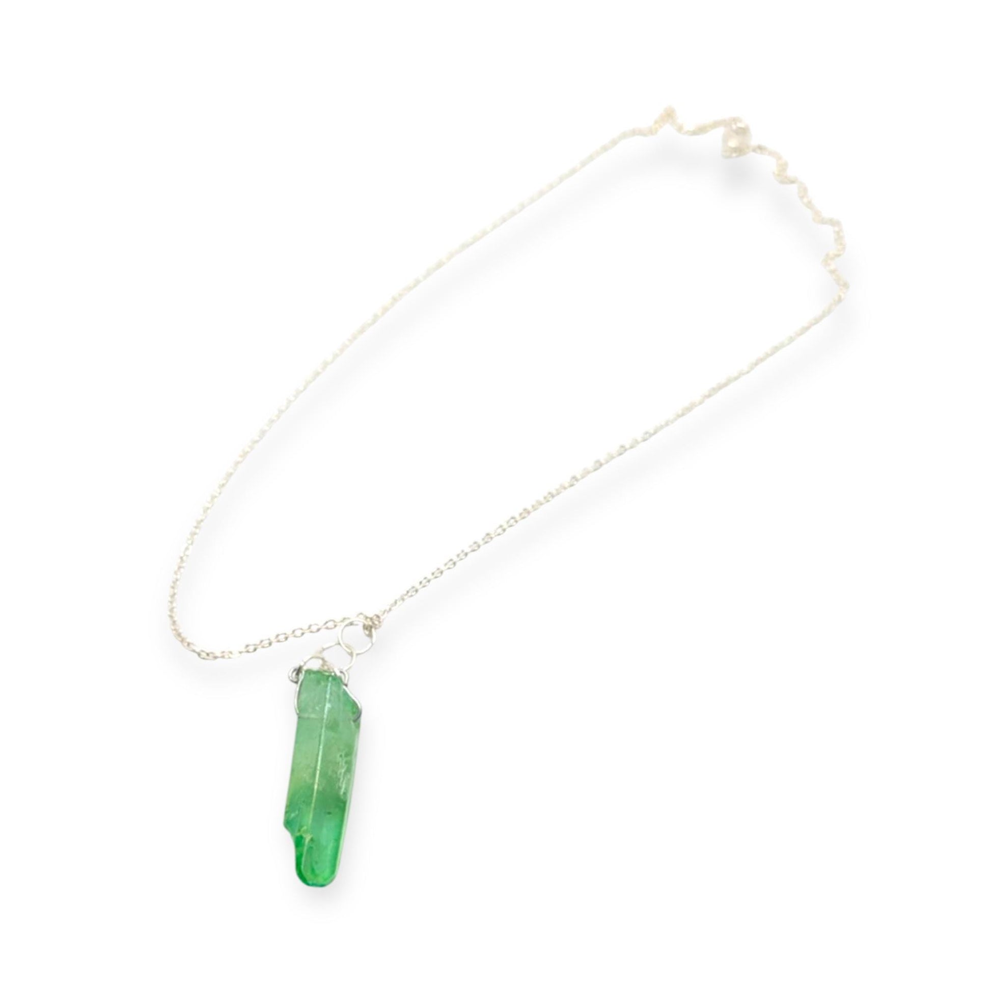 Necklace with a green crystal pendant on a white background