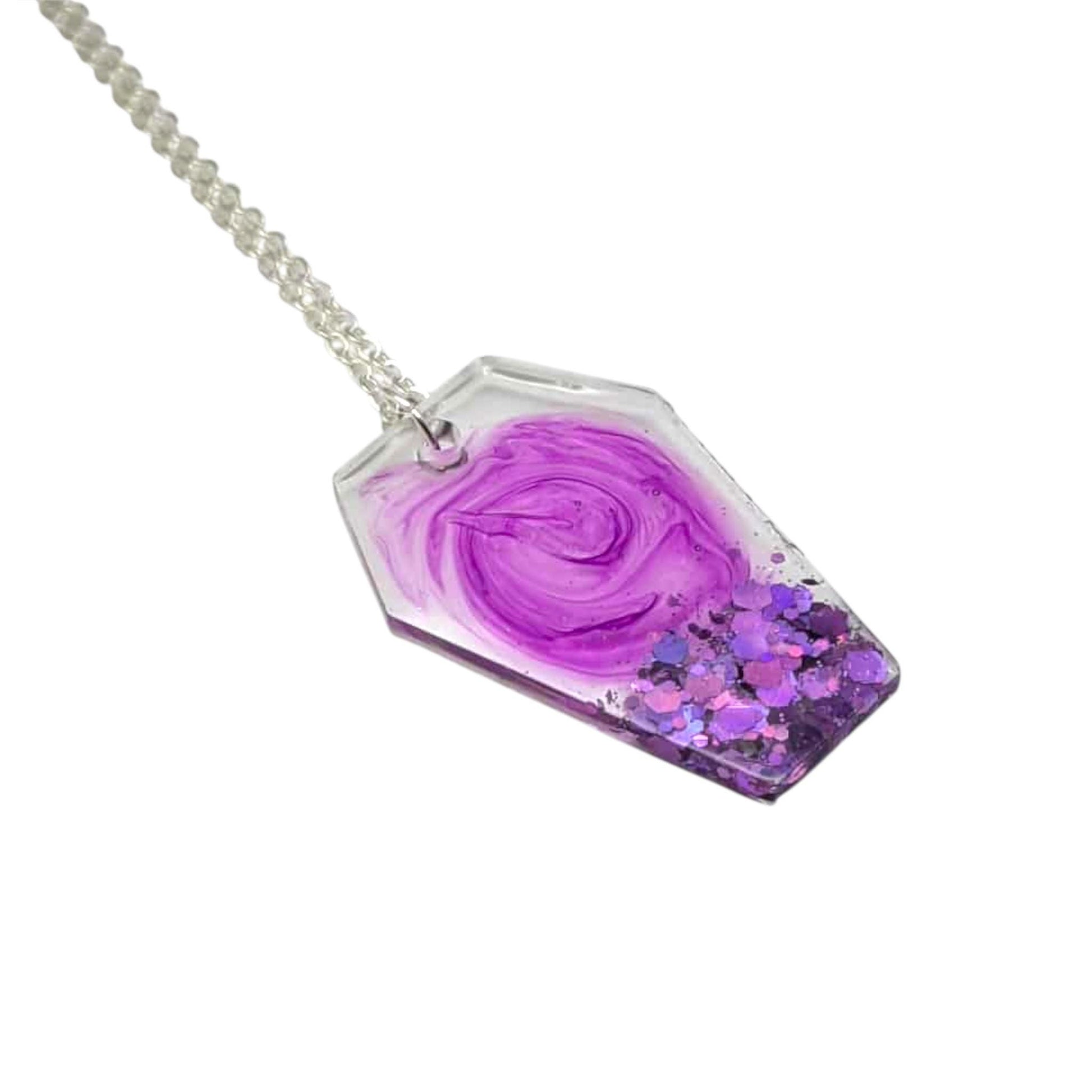 Necklace with a purple swirl-shaped pendant on a white background