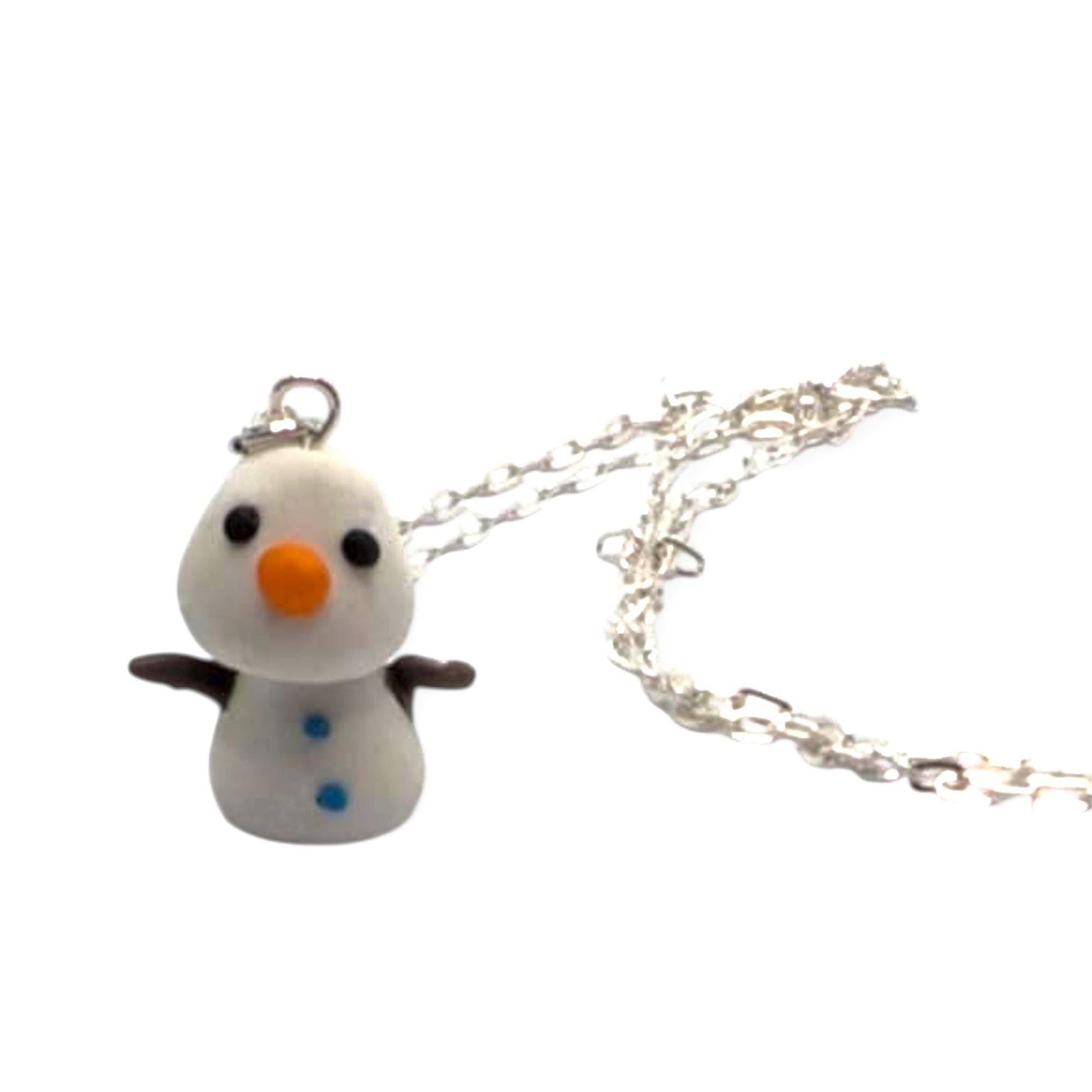 Snowman-shaped pendant on a silver chain against a white background