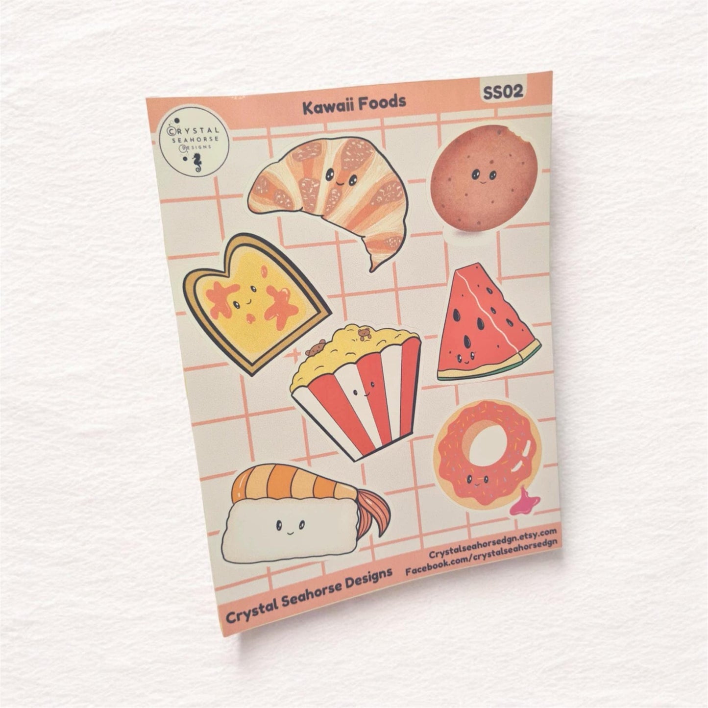 Sheet of kawaii food-themed stickers with cute illustrations on a pink grid background.