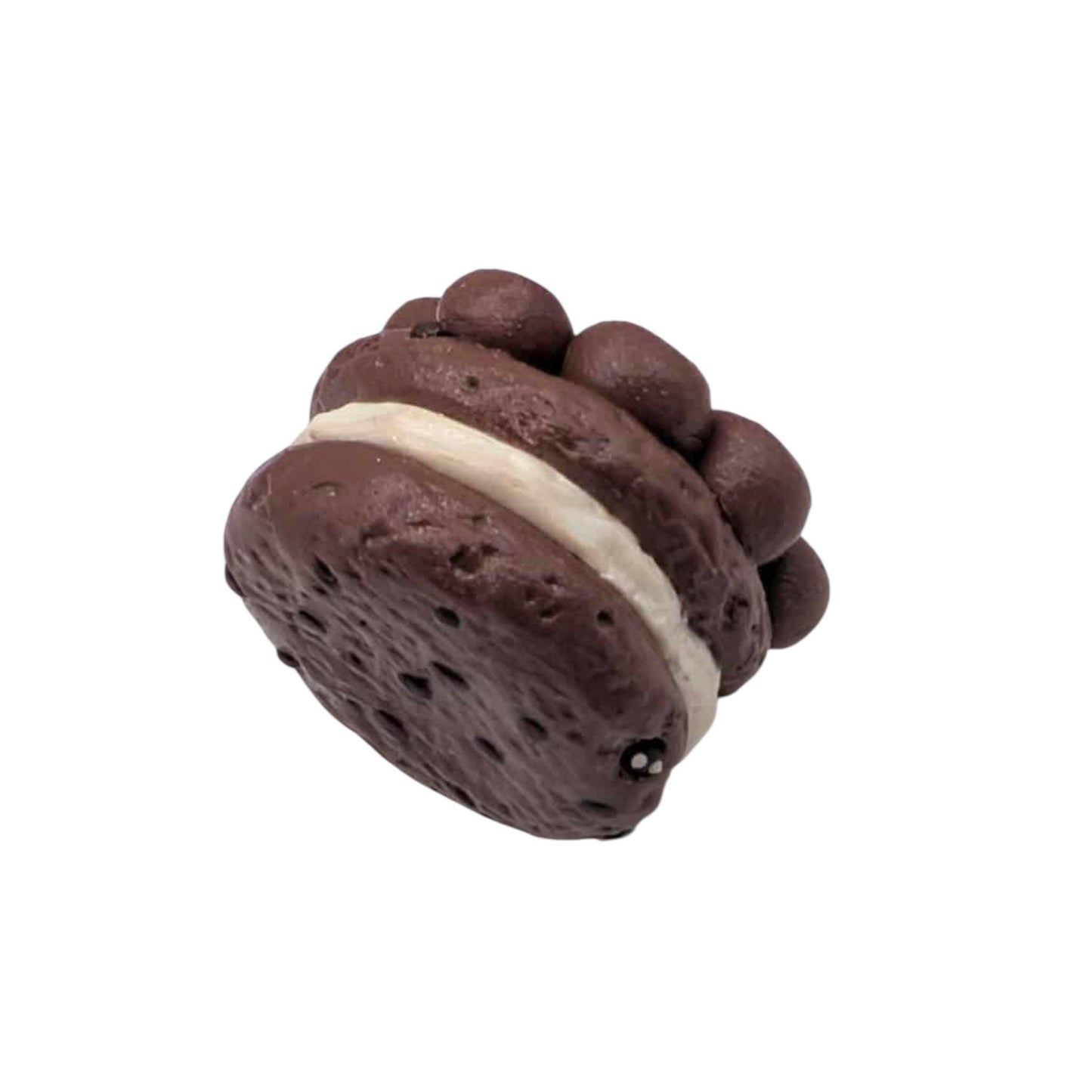 Chocolate cookie with cream filling on a white background