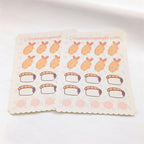 Sheet of stickers with cartoon sushi designs on a white background