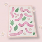 Kawaii Worm Sticker, cartoon Earth worm glossy stickers on a pale pink background 